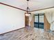 Bright dining room featuring hardwood floors, chandelier, and sliding glass door at 2017 Godfrey Ave, Spring Hill, FL 34609