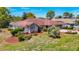 Charming home featuring a stone facade and well-manicured landscaping for enhanced curb appeal at 2017 Godfrey Ave, Spring Hill, FL 34609