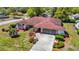Charming single-story home with stone accents, manicured landscaping, and a spacious driveway at 2017 Godfrey Ave, Spring Hill, FL 34609