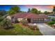 Charming single-story home with stone accents and well-manicured landscaping at 2017 Godfrey Ave, Spring Hill, FL 34609