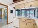 Bright kitchen space complete with dishwasher and sink with views to the outdoor pool at 2017 Godfrey Ave, Spring Hill, FL 34609