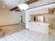 Bright kitchen with tiled floors, a bar counter, and stainless steel appliances at 2017 Godfrey Ave, Spring Hill, FL 34609