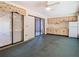 Bright living room with ceiling fan, sliding glass doors, and small kitchen area at 2017 Godfrey Ave, Spring Hill, FL 34609