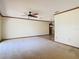 Bright and spacious living room with neutral carpeting and wood trim along the ceiling at 2017 Godfrey Ave, Spring Hill, FL 34609
