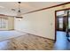 Spacious living area showcasing wood-look flooring and neutral color palette with natural light at 2017 Godfrey Ave, Spring Hill, FL 34609