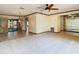Well-lit living room with hardwood floors, and a sliding glass door, creating seamless indoor-outdoor flow at 2017 Godfrey Ave, Spring Hill, FL 34609