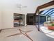 Large patio with star design, attached to the enclosed lanai, and providing access to the pool at 2017 Godfrey Ave, Spring Hill, FL 34609
