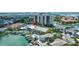Beautiful aerial of home on the water with a pool and boat dock at 234 Dolphin Pt # 1, Clearwater Beach, FL 33767