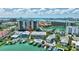 Aerial view of waterfront home with pool and boat dock at 234 Dolphin Pt # 1, Clearwater Beach, FL 33767