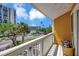 Balcony overlooking trees and street at 234 Dolphin Pt # 1, Clearwater Beach, FL 33767