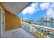 Balcony overlooking the waterway and boat docks below at 234 Dolphin Pt # 1, Clearwater Beach, FL 33767
