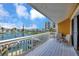 Balcony with seating overlooking water and neighborhood buildings at 234 Dolphin Pt # 1, Clearwater Beach, FL 33767