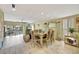 Open-concept dining room with waterfront views and natural light at 234 Dolphin Pt # 1, Clearwater Beach, FL 33767