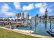 Beautiful view of a private boat dock with boat lift showcasing waterfront lifestyle at 234 Dolphin Pt # 1, Clearwater Beach, FL 33767
