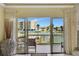 Bright living room featuring water views and a private balcony at 234 Dolphin Pt # 1, Clearwater Beach, FL 33767