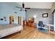 Open main bedroom with hardwood floors, a fan, and a walk-in closet at 234 Dolphin Pt # 1, Clearwater Beach, FL 33767