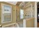Walk-in shower featuring a glass enclosure, tiled walls and shower head at 234 Dolphin Pt # 1, Clearwater Beach, FL 33767