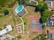 The aerial shot showcases a playground and tennis courts next to the residences at 2904 Pointer Pl, Seffner, FL 33584