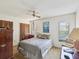 Comfortable bedroom offers a calming atmosphere with ample natural light and ceiling fan at 2904 Pointer Pl, Seffner, FL 33584