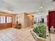 Inviting foyer showcasing a decorative stone-lined garden feature, complemented by elegant wooden double doors at 2904 Pointer Pl, Seffner, FL 33584
