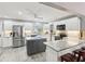 A well lit kitchen featuring stainless steel appliances, bright cabinets, and a spacious marble island at 2904 Pointer Pl, Seffner, FL 33584
