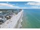 Stunning aerial view showcases the beach, coastline, and clear blue ocean waters at 321 Bahia Vista Dr, Indian Rocks Beach, FL 33785