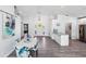 Dining room with seating for six with adjacent kitchen and views toward front door at 321 Bahia Vista Dr, Indian Rocks Beach, FL 33785