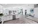 Open concept kitchen/living area that leads out to a patio overlooking a canal at 321 Bahia Vista Dr, Indian Rocks Beach, FL 33785