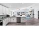 Modern kitchen with granite countertops, stainless steel appliances, and an open layout that enhances the waterfront view at 321 Bahia Vista Dr, Indian Rocks Beach, FL 33785