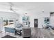 Living room featuring fireplace, canal views, and a seamless flow into the adjacent dining and kitchen areas at 321 Bahia Vista Dr, Indian Rocks Beach, FL 33785
