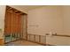 Partially demoed bathroom with exposed framing, offering remodeling potential at 39696 Meadowood Loop, Zephyrhills, FL 33542