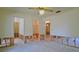 Bedroom with access to several rooms, ready for renovation at 39696 Meadowood Loop, Zephyrhills, FL 33542