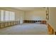 Bright, open living room space offering great potential for renovations and personalization at 39696 Meadowood Loop, Zephyrhills, FL 33542