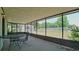 Enclosed patio featuring outdoor furniture and yard view at 39696 Meadowood Loop, Zephyrhills, FL 33542