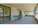 Enclosed patio featuring outdoor furniture at 39696 Meadowood Loop, Zephyrhills, FL 33542