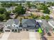 Property aerial view showcases a well-manicured neighborhood close to retail and commerce at 4007 W Gray St, Tampa, FL 33609