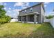 Expansive backyard featuring a screened-in porch for outdoor living and entertaining at 4007 W Gray St, Tampa, FL 33609