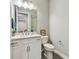 Clean bathroom with vanity, commode and tile flooring at 4007 W Gray St, Tampa, FL 33609