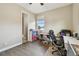 This bedroom features wood floors, two windows for natural light, and is staged as a home office at 4007 W Gray St, Tampa, FL 33609