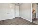 This bedroom features wood floors, and views into both the closet and en suite bathroom at 4007 W Gray St, Tampa, FL 33609