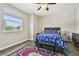 Bedroom featuring natural lighting, ceiling fan, and wood floor at 4007 W Gray St, Tampa, FL 33609