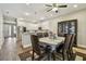 Dining room with wood flooring, dining table and dark wood china cabinet at 4007 W Gray St, Tampa, FL 33609