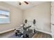 A great exercise room with wood flooring features a window and weight bench at 4007 W Gray St, Tampa, FL 33609