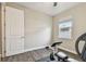This home exercise room with a window, ceiling fan, and wood floors is ready for workouts at 4007 W Gray St, Tampa, FL 33609
