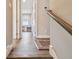 View of hallway with wood floors leading to office with desk and chair at 4007 W Gray St, Tampa, FL 33609