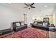 Spacious living room with comfortable leather sofas and an oriental rug at 4007 W Gray St, Tampa, FL 33609