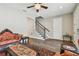 Elegant living room boasts hardwood floors, a ceiling fan, and a staircase at 4007 W Gray St, Tampa, FL 33609