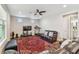 Cozy living room featuring a comfortable seating arrangement and a ceiling fan at 4007 W Gray St, Tampa, FL 33609