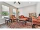 Elegant living room boasts hardwood floors and multiple windows at 4007 W Gray St, Tampa, FL 33609