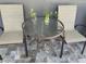 Outdoor patio seating area with a round table and two chairs, perfect for relaxing at 4007 W Gray St, Tampa, FL 33609